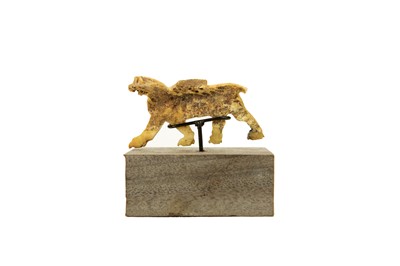 Lot 1062 - A Phoenician bone plaque of a winged lion.