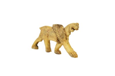 Lot 1062 - A Phoenician bone plaque of a winged lion.