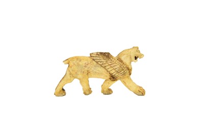Lot 1062 - A Phoenician bone plaque of a winged lion.