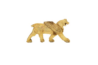 Lot A Phoenician bone plaque of a winged lion.