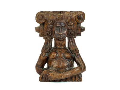 Lot A carved oak female caryatid figure.