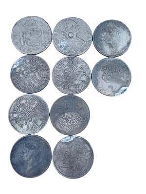 Lot 1210 - A collection of eight replica Victoria Hong Kong dollar coins.