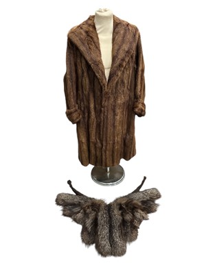 Lot 94 - A vintage fur coat and stole, the coat is...