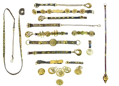 Lot 101 - A collection of horse brasses, martingales, and other fittings.