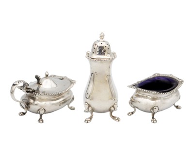 Lot 172 - A Victorian silver three piece cruet set by James Deakin & Sons.