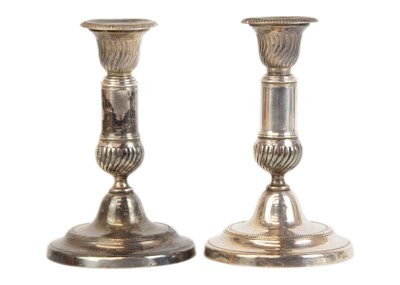 Lot 62 - A pair of late George III white metal telescopic candlesticks