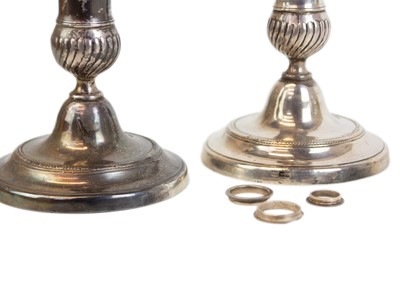 Lot 62 - A pair of late George III white metal telescopic candlesticks