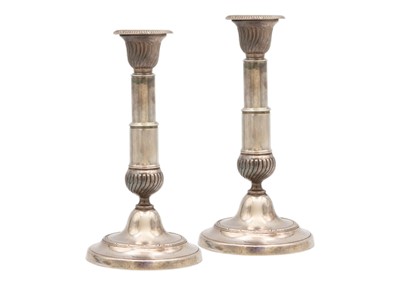 Lot 261 - A pair of late George III white metal telescopic candlesticks.