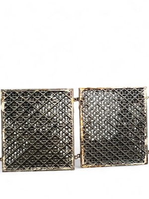 Lot 1030 - A pair of cast iron grilles