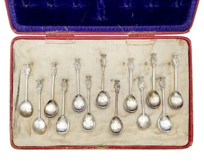 Lot 112 - A George V silver cased set of thirteen seal top apostle spoons by Thomas Bradbury & Sons Ltd.