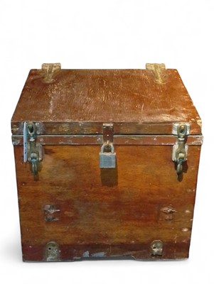 Lot 976 - A wooden lidded box with brass hinges, band and locks