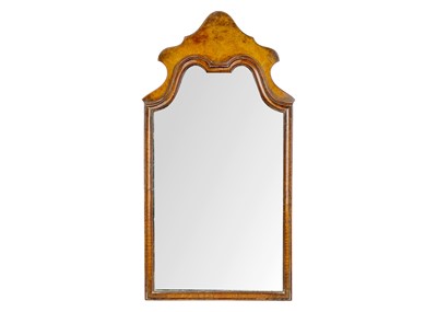 Lot 553 - A Queen Anne style walnut fret cut mirror.