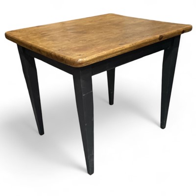 Lot 103 - A pine kitchen/dining table with black painted...