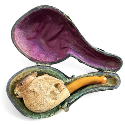 Lot 20 - A Meerschaum pipe with an amber stem depicting...