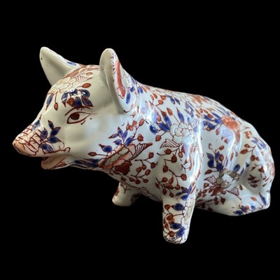 Lot 100 - A 20th-century Imari palette ceramic pig with...