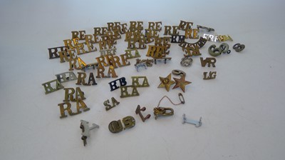 Lot 51 - A collection of brass shoulder titles, mostly...