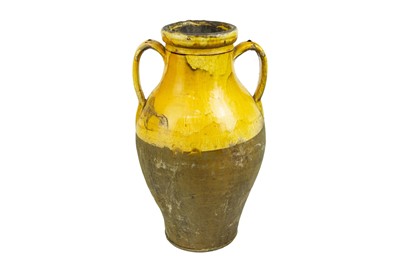 Lot 1037 - A French provincial yellow glazed large vase.