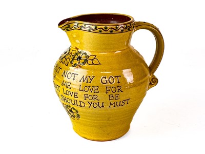 Lot 373 - A Harry Juniper, Bideford studio pottery jug with sgraffito decoration and verse.