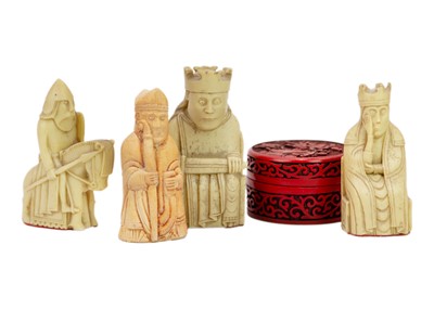 Lot 1068 - Four resin Lewis chessmen.