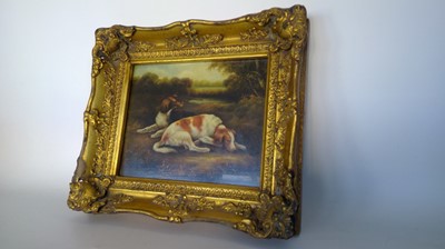 Lot 160 - An oleograph of two dogs, in an elaborate gilt...