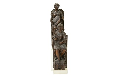 Lot 1057 - A pair of Italian walnut figures of musicians.