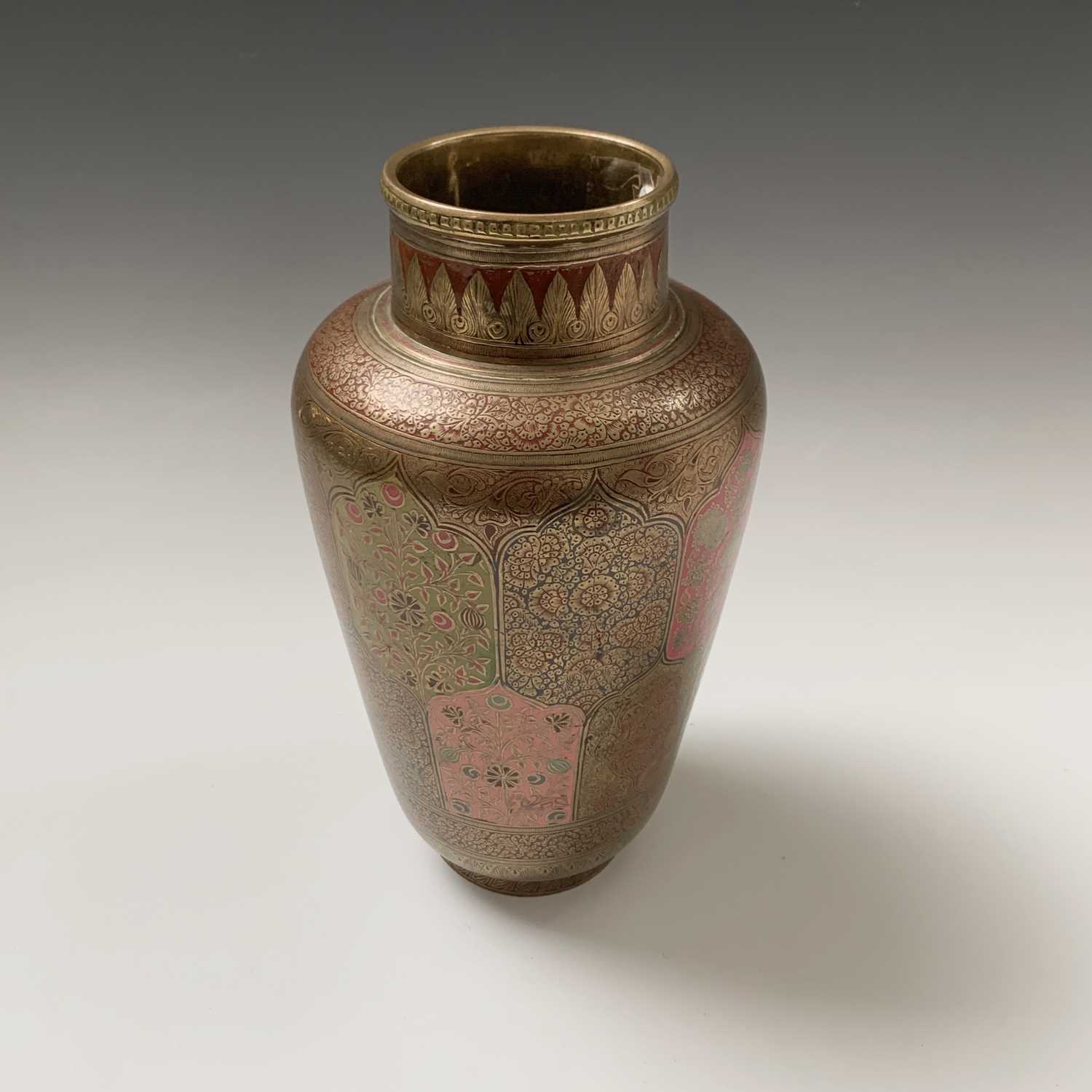 Lot 375 - An Indian brass vase, with polychrome shaped...