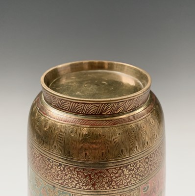 Lot 375 - An Indian brass vase, with polychrome shaped...