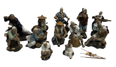 Lot 59 - A collection of Chinese Wanjiang 'Mud Man'...