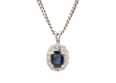 Lot 92 - An 18ct white gold sapphire and diamond cluster pendant and a pair of similar 9ct cluster earrings.