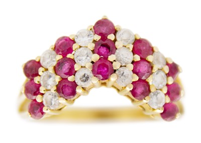 Lot 94 - A 14ct gold red spinel and CZ set wishbone ring.