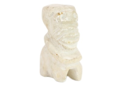 Lot 1067 - A carved white stone figure.