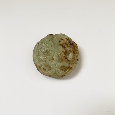 Lot 52 - A Chinese jade carving, decorated with a...
