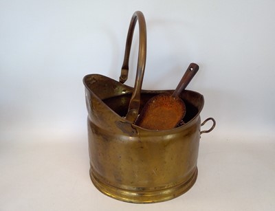 Lot 148 - A brass coal scuttle and scoop, currently...