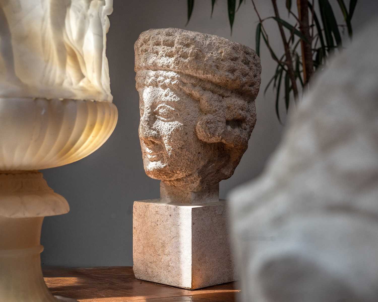 Lot 95 - A Cypriot limestone head of a female Votary.