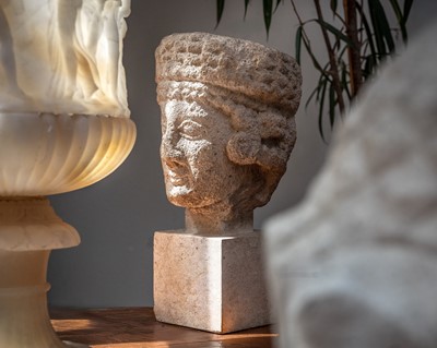 Lot 95 - A Cypriot limestone head of a female Votary.