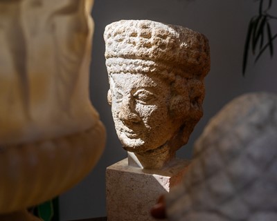 Lot 95 - A Cypriot limestone head of a female Votary.