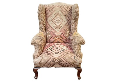 Lot 689 - A mahogany framed wingback armchair.