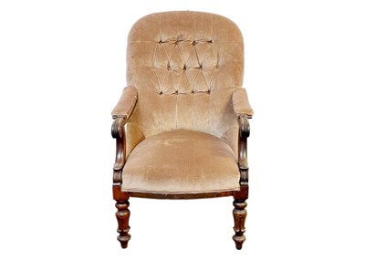 Lot 694 - An early Victorian button back mahogany framed armchair.