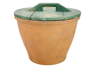 Lot 78 - A large terracotta crock pot and wood cover.