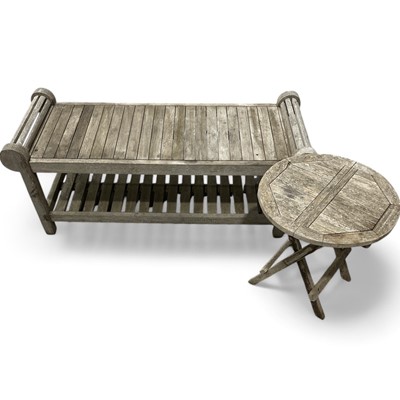 Lot 31 - A teak garden bench 130cm wide, 43cm high and...