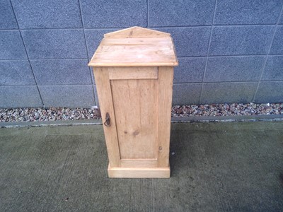 Lot 35 - A Stripped Pine Bedside Cabinet. It is 80cm...