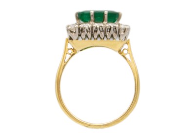 Lot 190 - An attractive emerald and diamond 18ct set cluster ring.