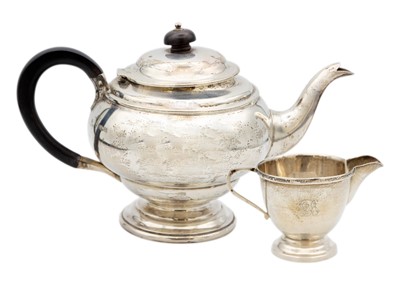 Lot 134 - A George V silver ovoid pedestal teapot by James Deakin & Sons.