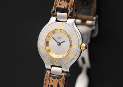 Lot 57A - MUST DE CARTIER - A Must 21 bi-metal lady's quartz wristwatch.