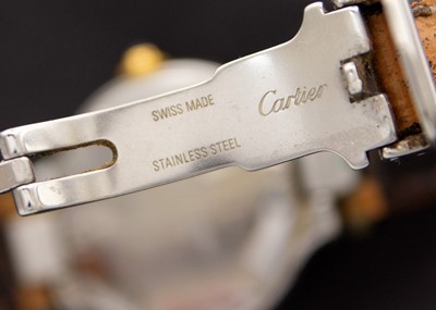 Lot 57 - MUST DE CARTIER - A Must 21 bi-metal lady's quartz wristwatch.