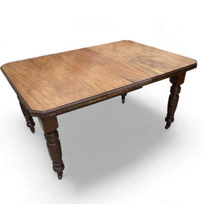 Lot 32 - Edwardian walnut extending dining table, leaf...