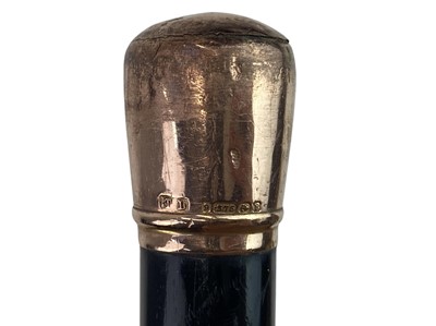 Lot 144 - A 9ct gold top ebony cane.
