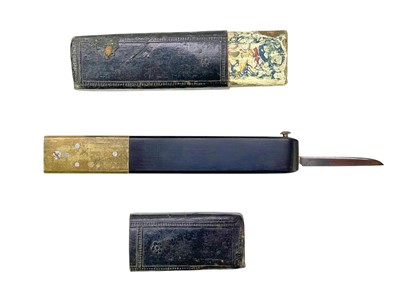 Lot 40 - A Victorian brass and ebony quill cutter.