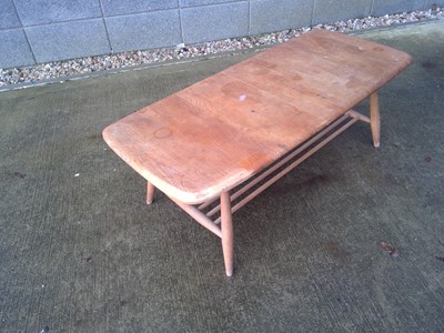 Lot 5 - An Ercol Coffee Table. With a Magazine Rack...
