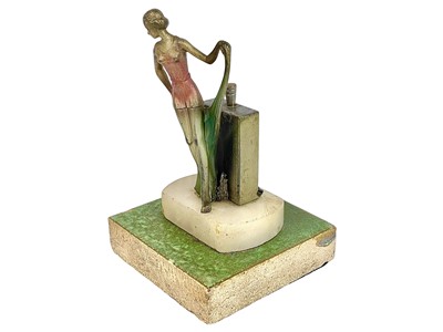 Lot 97 - An Art Deco spelter strike table lighter.